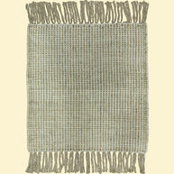 Textured woven blanket with fringe on a white background