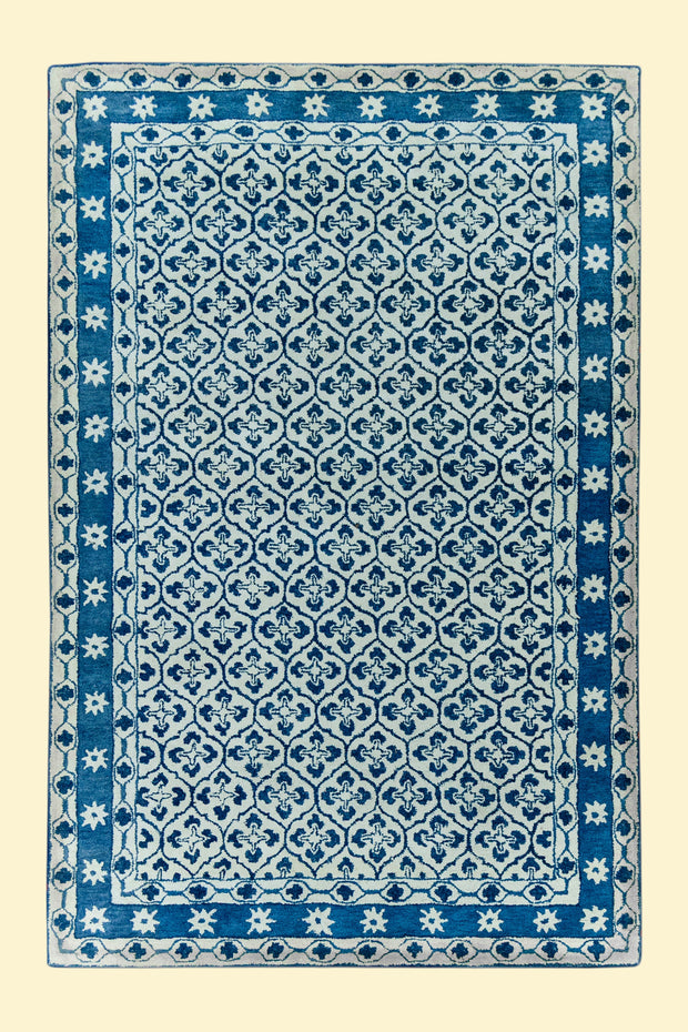 Blue and White Patterned Hand-Tufted Woolen Handmade Rug for bed rooms, offices, and dining spaces. 