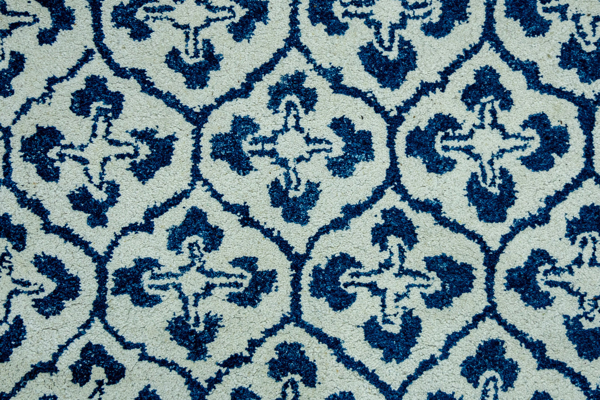 Detail  Shot of Blue and White Patterned Hand-Tufted Woolen Handmade Rug for bed rooms, offices, and dining spaces. 