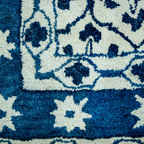 Detail  Shot of Blue and White Patterned Hand-Tufted Woolen Handmade Rug for bed rooms, offices, and dining spaces. 