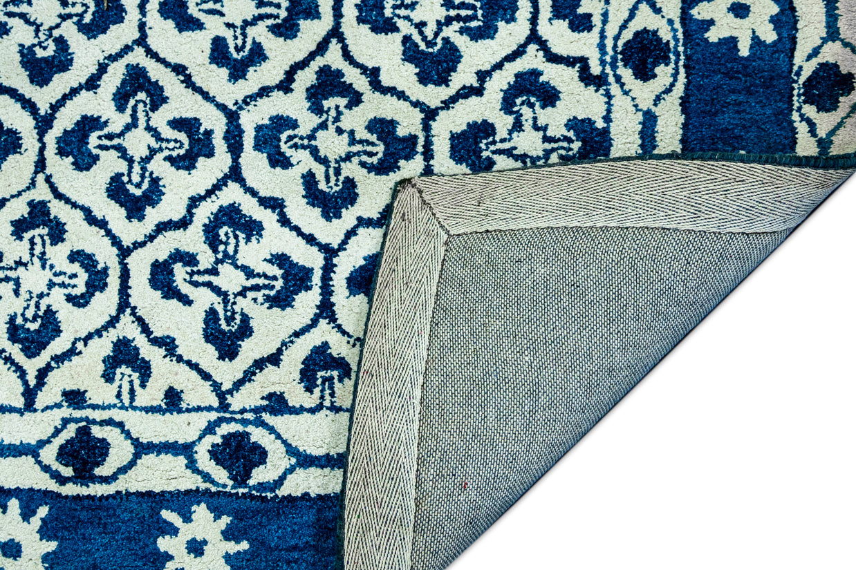 Detail  Shot of Blue and White Patterned Hand-Tufted Woolen Handmade Rug for bed rooms, offices, and dining spaces. 