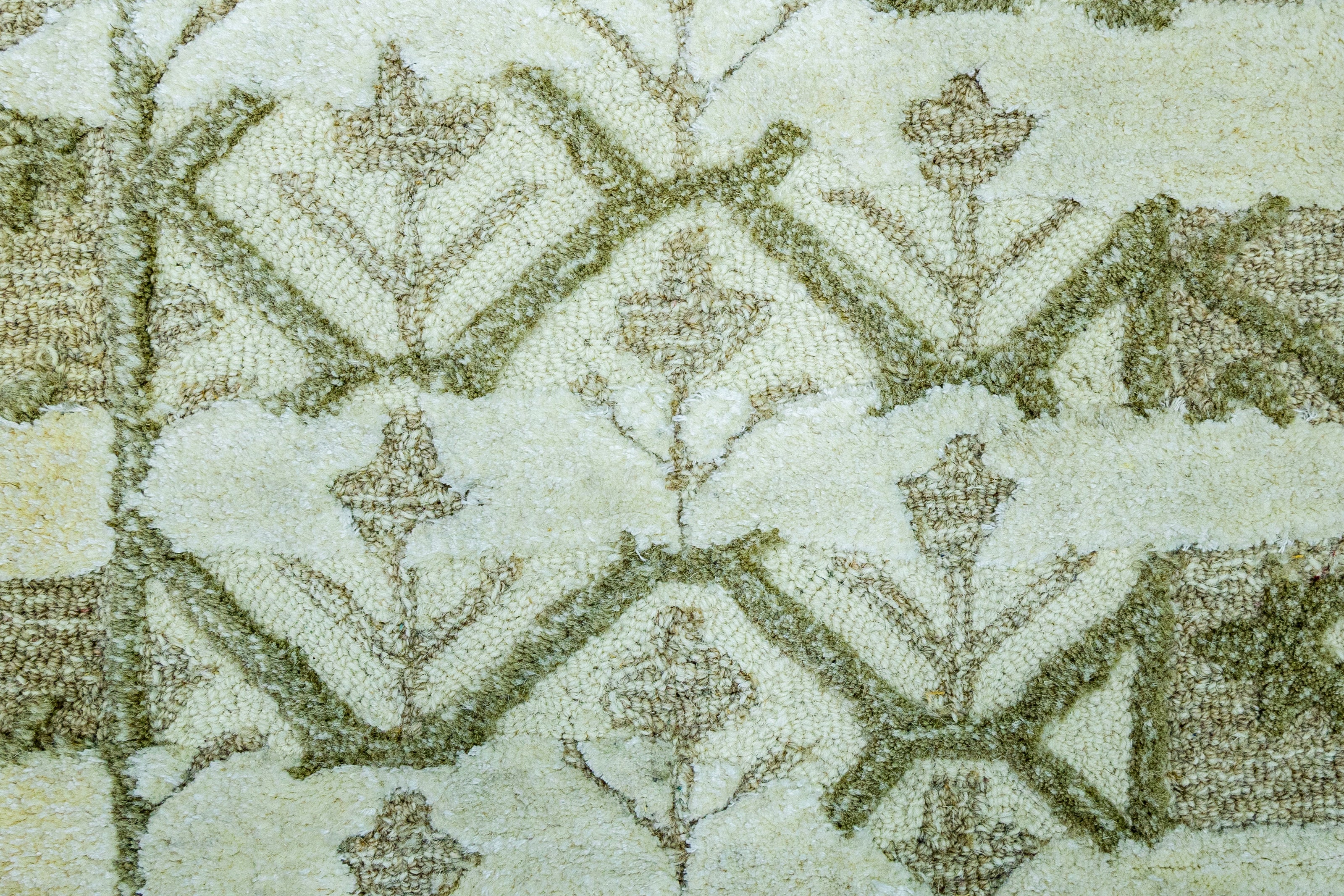 Detail Shot of Luxury Ivory/Cream Hand-Tufted Woolen Rug for bed rooms, offices, and dining spaces with Geometric Pattern