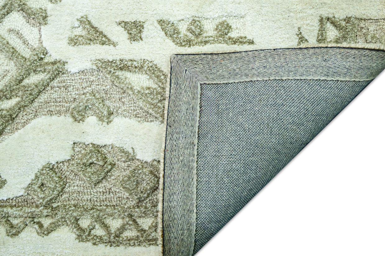 Detail Shot of Luxury Ivory/Cream Hand-Tufted Woolen Rug for bed rooms, offices, and dining spaces with Geometric Pattern