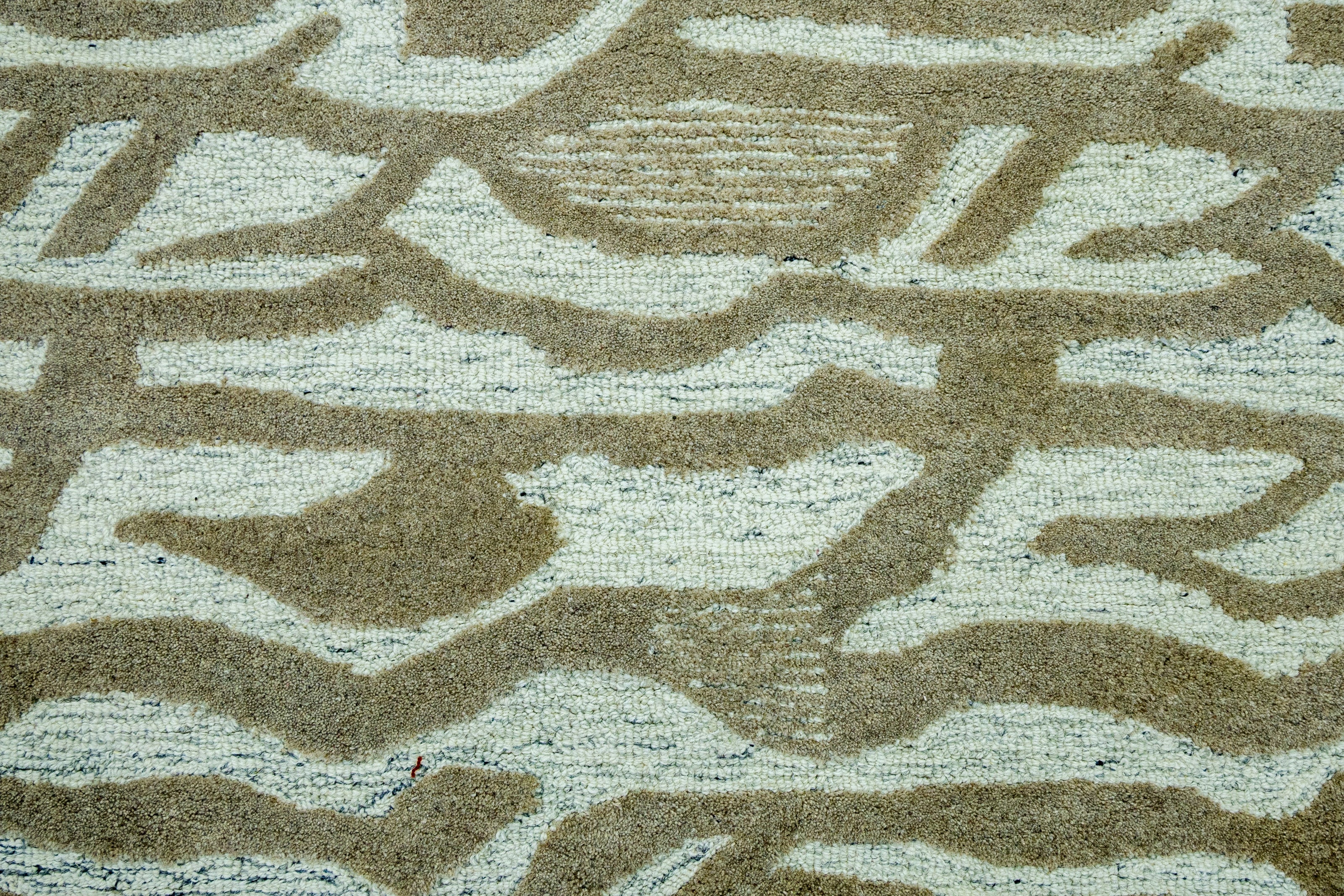Detail Shot of Hand-Tufted Woolen Handmade Rug for bed rooms, offices, and dining spaces. with Wavy Pattern