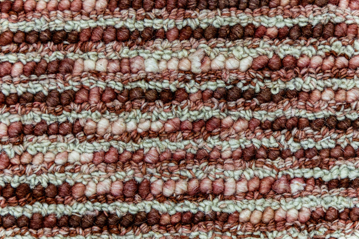 Detail shot of Textured Hand-Tufted Woolen Handmade Rug for bed rooms, offices, and dining spaces. 