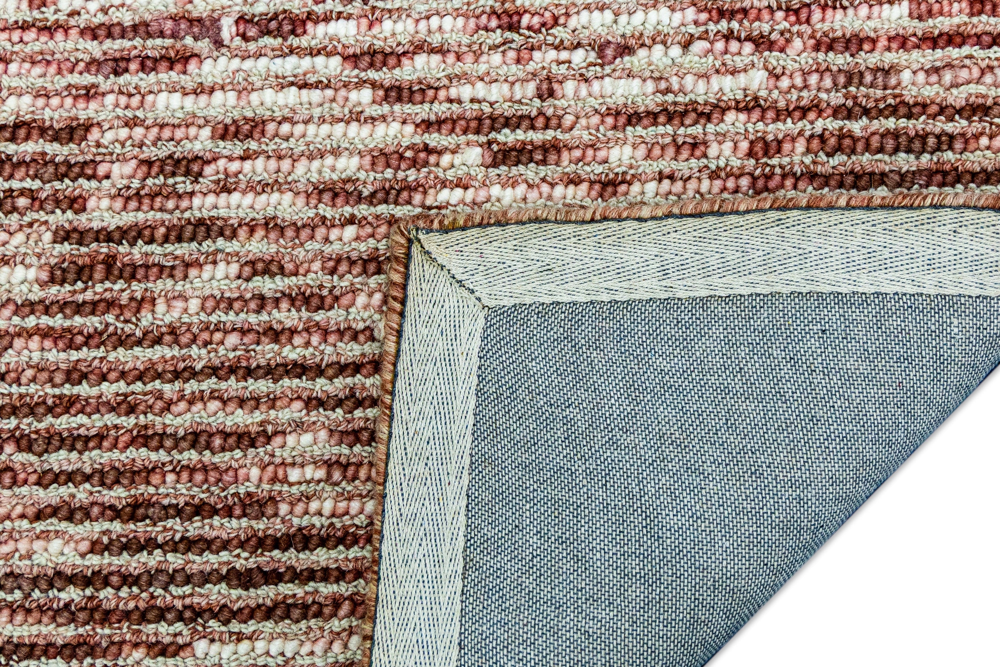 Detail of Detail shot of Textured Hand-Tufted Woolen Handmade Rug for bed rooms, offices, and dining spaces. 