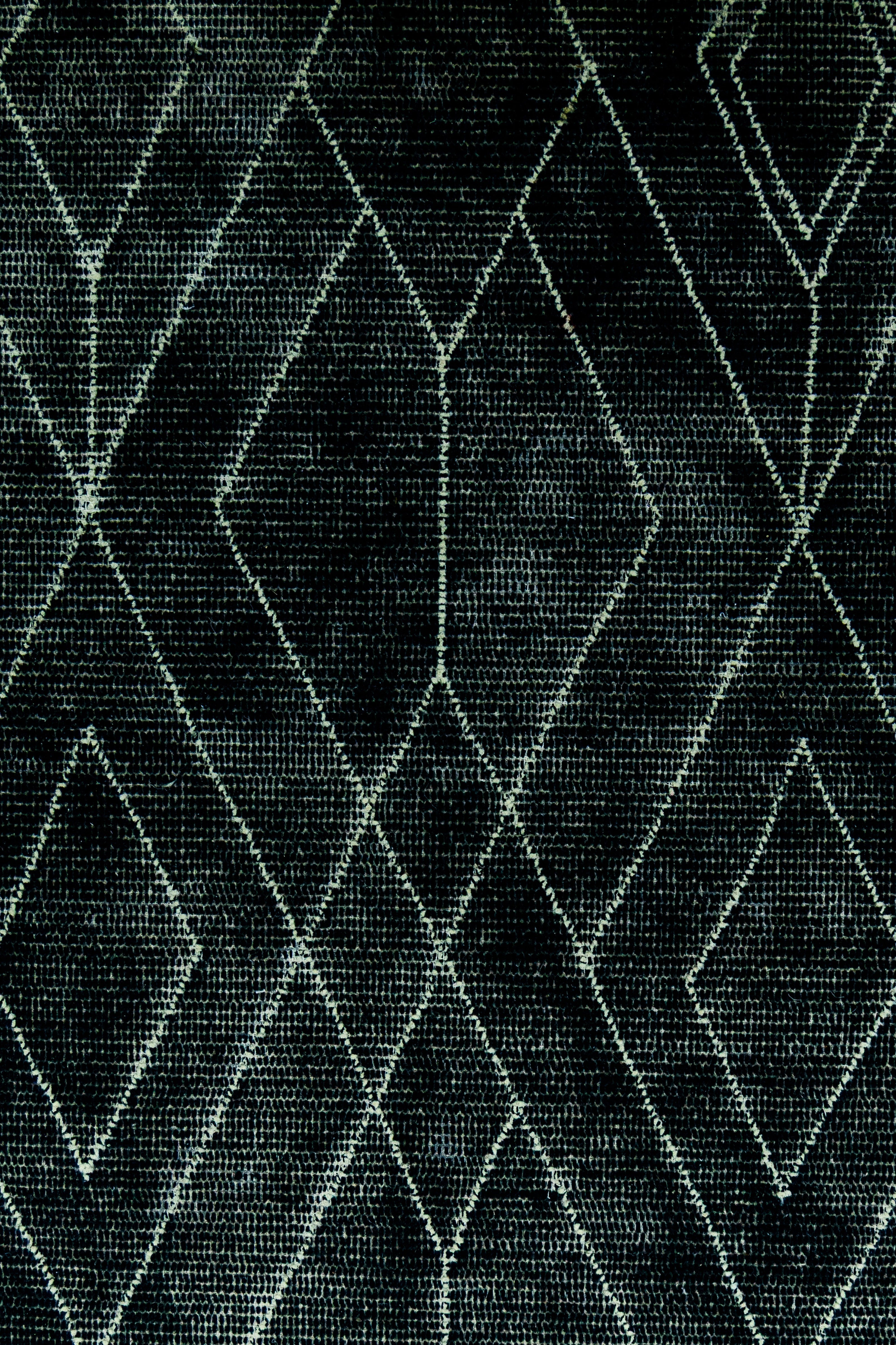 Detail Shot of Black Hand-Tufted Woolen Handmade Rug for bed rooms, offices, and dining spaces.