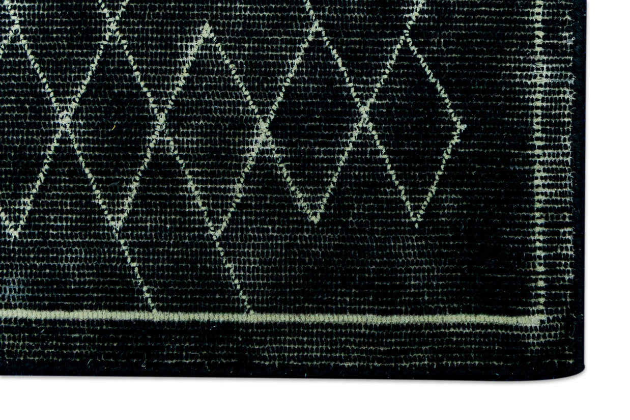 Detail for Black Hand-Tufted Woolen Handmade Rug for bed rooms, offices, and dining spaces.
