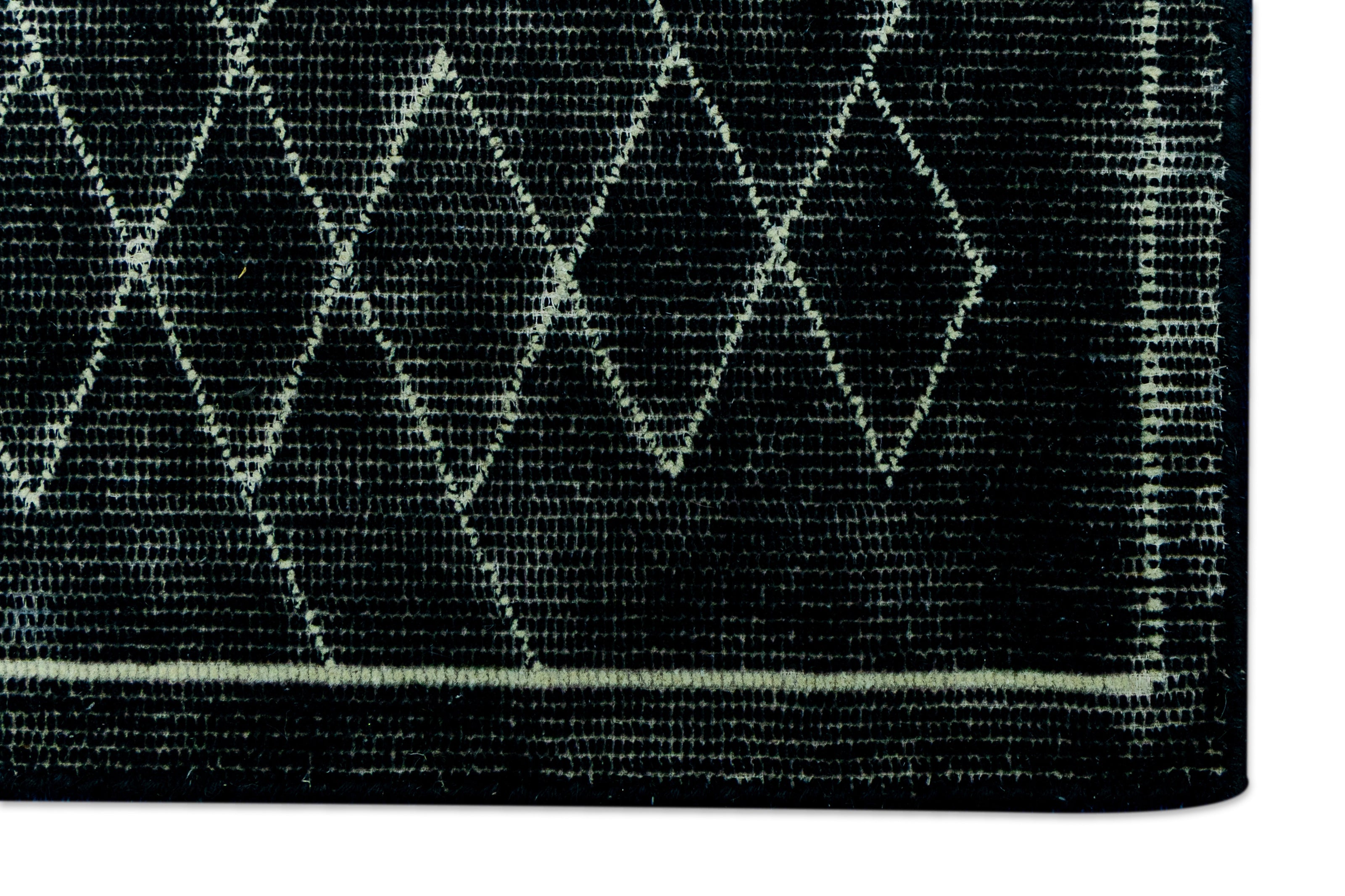 Detail for Black Hand-Tufted Woolen Handmade Rug for bed rooms, offices, and dining spaces.