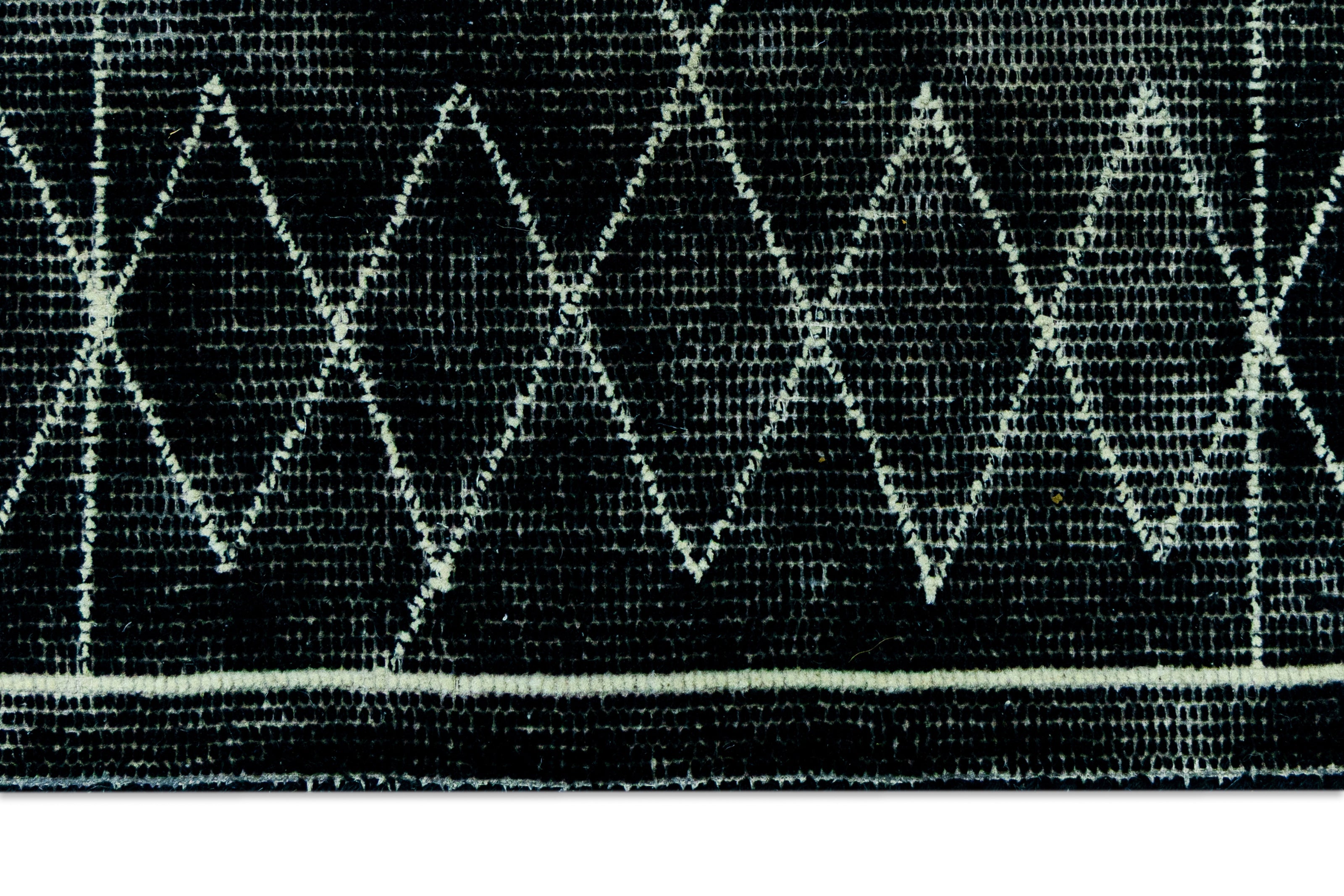 Detail Shot of Black Hand-Tufted Woolen Handmade Rug for bed rooms, offices, and dining spaces.