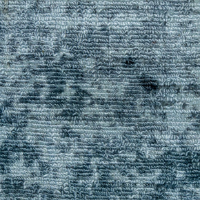 Detail shot of Blue Textured Hand-Loom Printed Viscose Handmade Rug for bed rooms, offices, and dining spaces.
