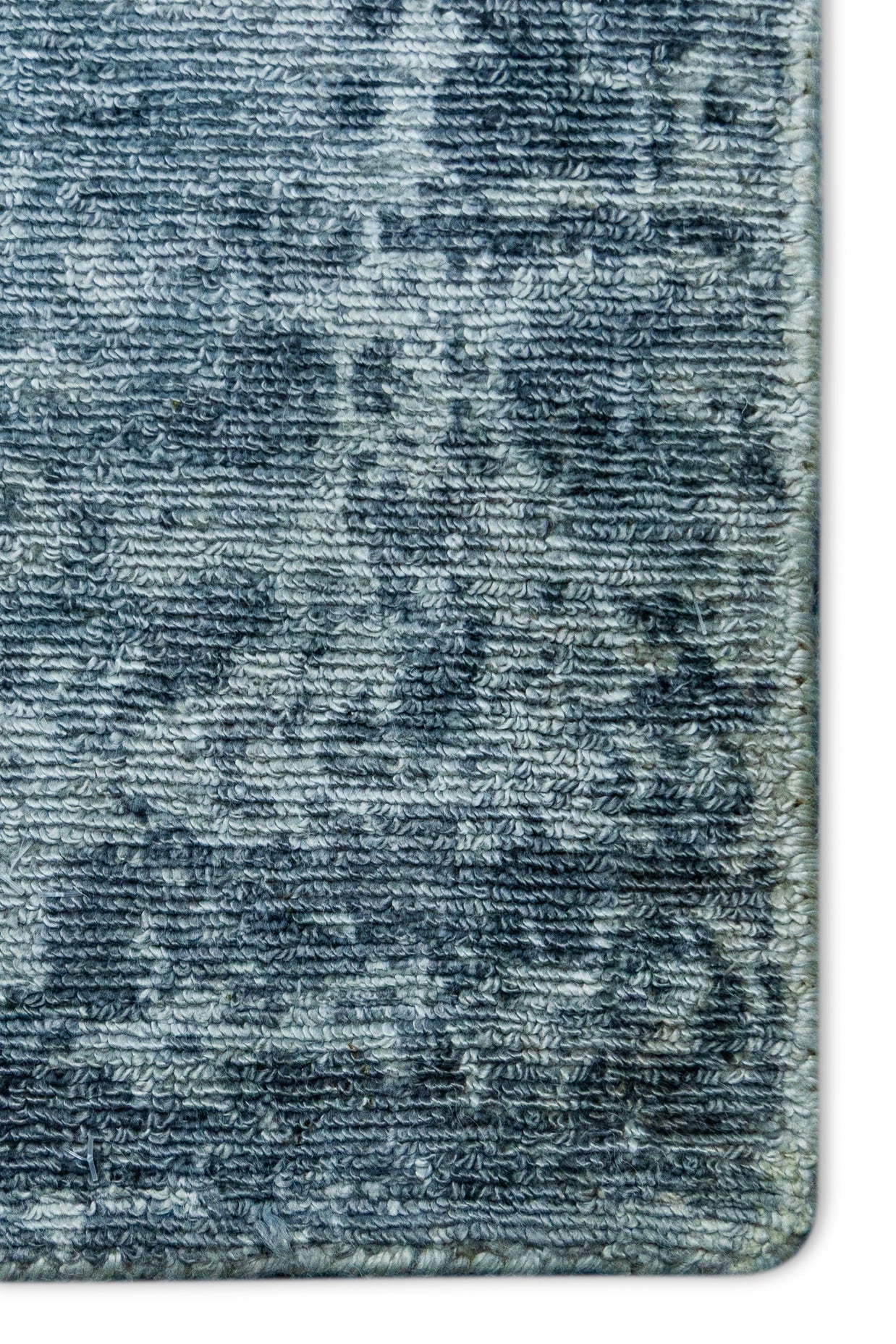 Detail shot of Blue Textured Hand-Loom Printed Viscose Handmade Rug for bed rooms, offices, and dining spaces.