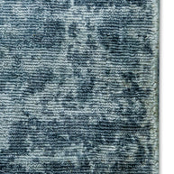 Detail shot of Blue Textured Hand-Loom Printed Viscose Handmade Rug for bed rooms, offices, and dining spaces.