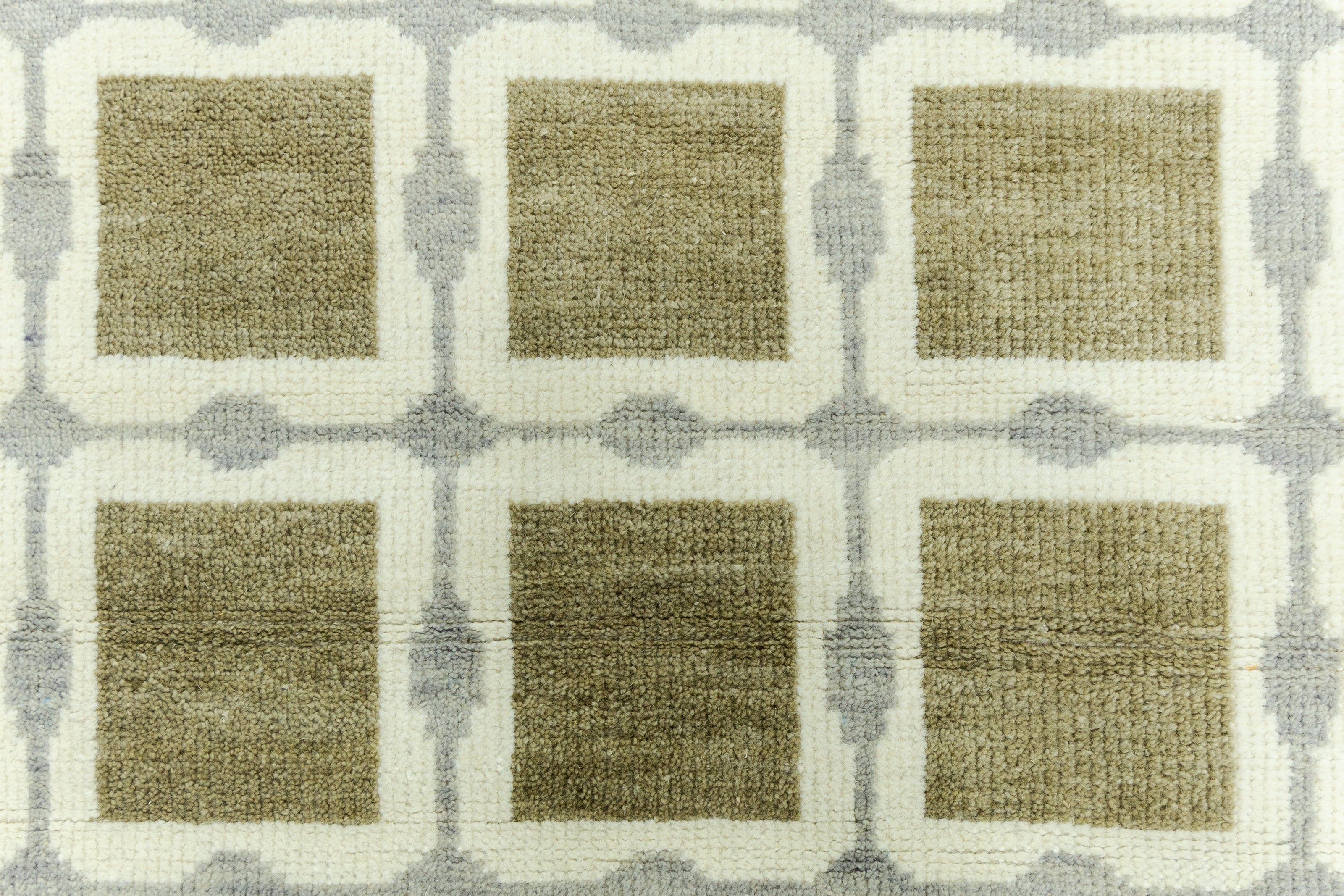 Detail Shot of Patterned Rug with Green Beige Squares Hand-Knotted New Zealand Wool Handmade Rug for bed rooms, offices, and dining spaces