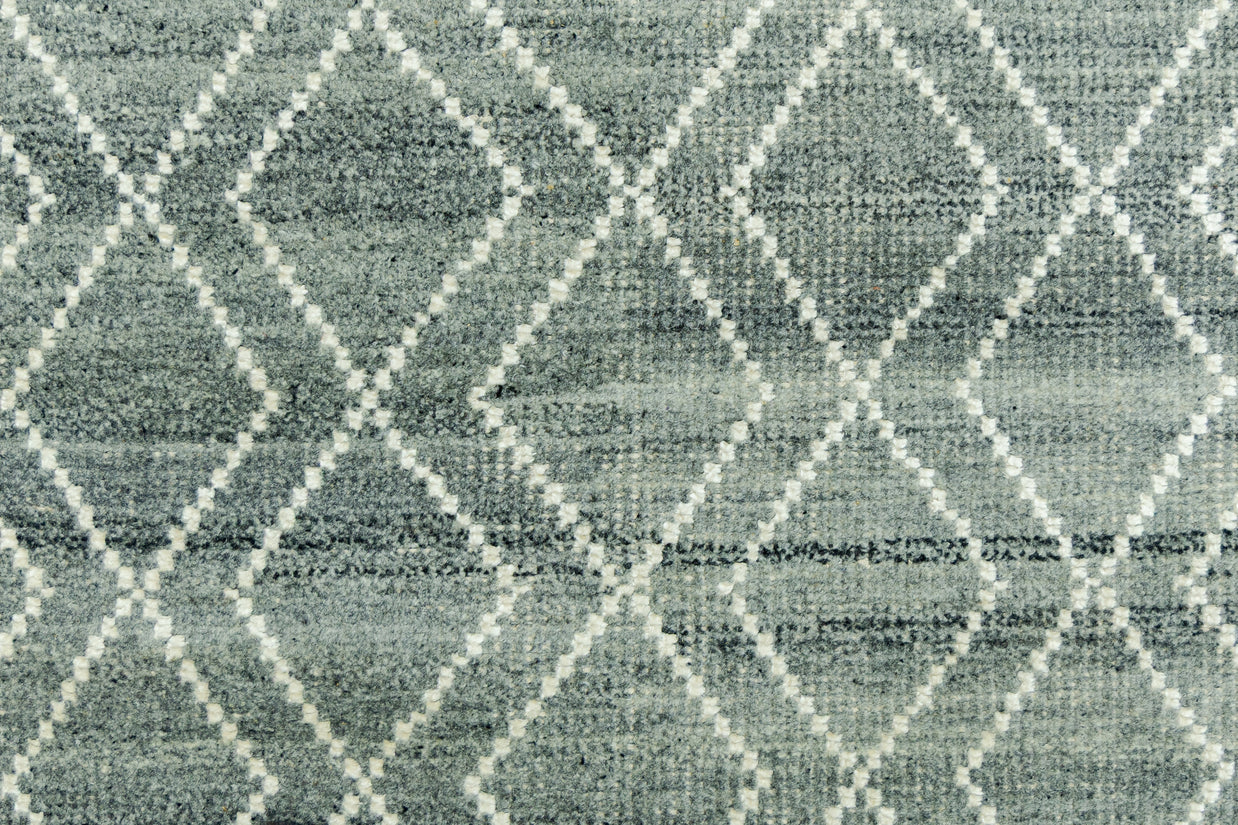 Detail Shot of Blue Geometric Patterned Hand-Loom Viscose Handmade Rug for bed rooms, offices, and dining spaces. 