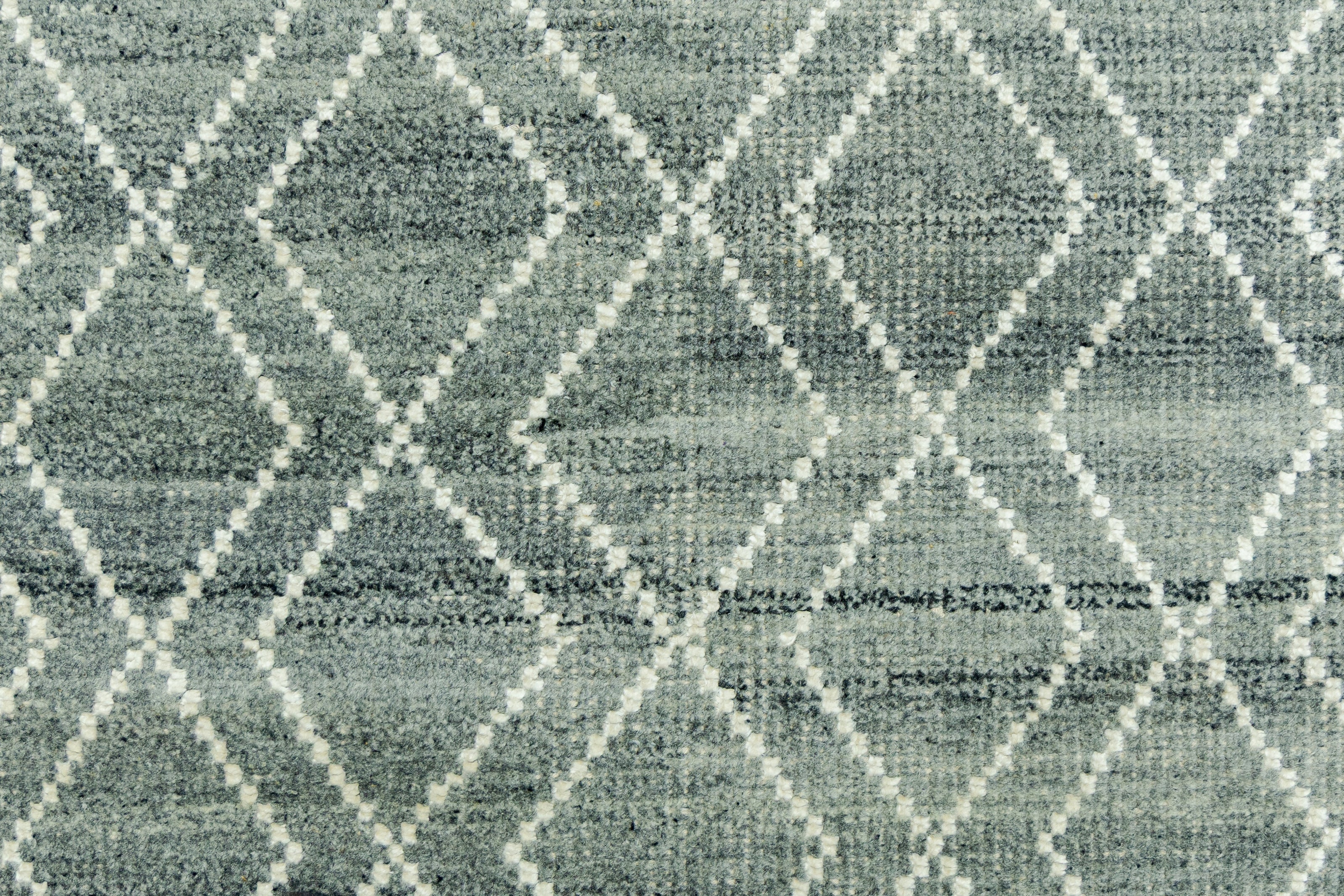 Detail Shot of Blue Geometric Patterned Hand-Loom Viscose Handmade Rug for bed rooms, offices, and dining spaces. 