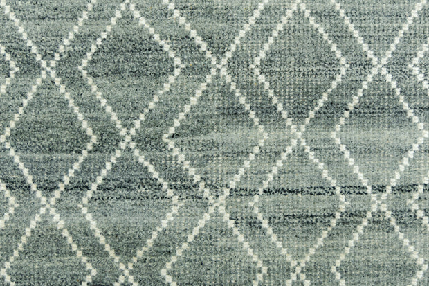 Detail Shot of Blue Geometric Patterned Hand-Loom Viscose Handmade Rug for bed rooms, offices, and dining spaces. 