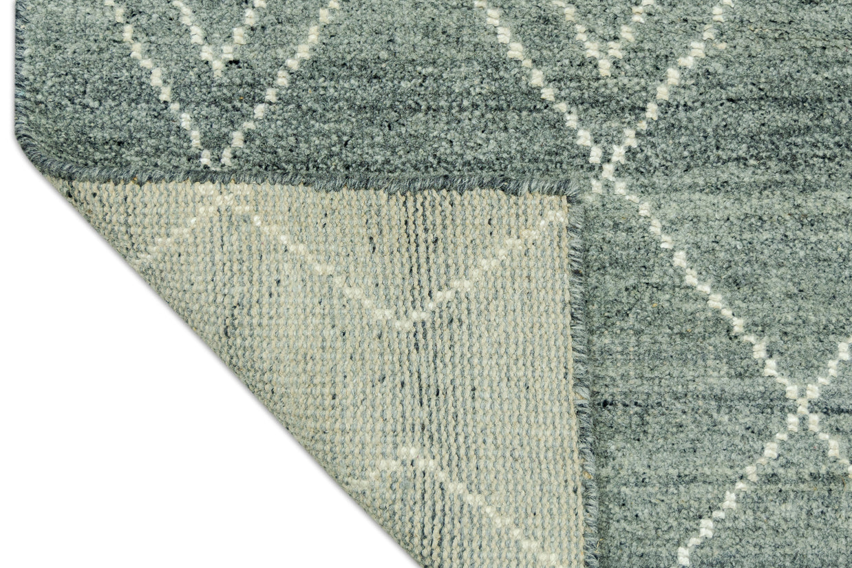 Detail Shot of Blue Geometric Patterned Hand-Loom Viscose Handmade Rug for bed rooms, offices, and dining spaces. 