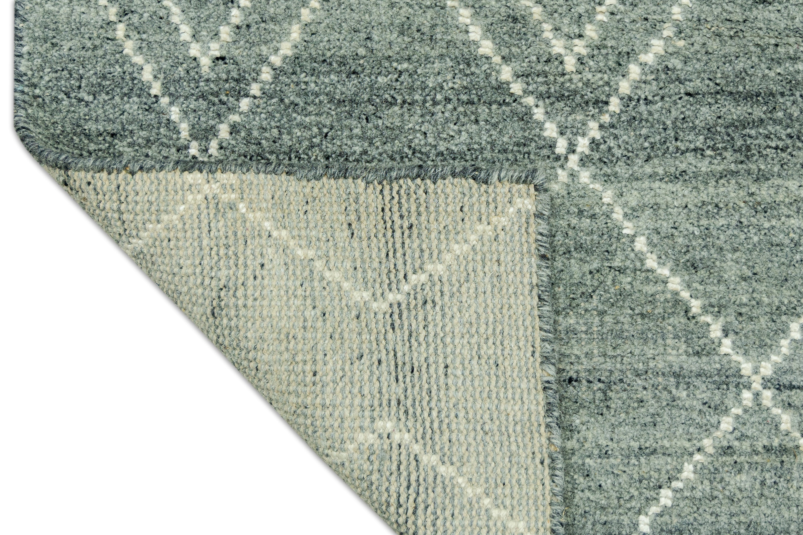 Detail Shot of Blue Geometric Patterned Hand-Loom Viscose Handmade Rug for bed rooms, offices, and dining spaces. 