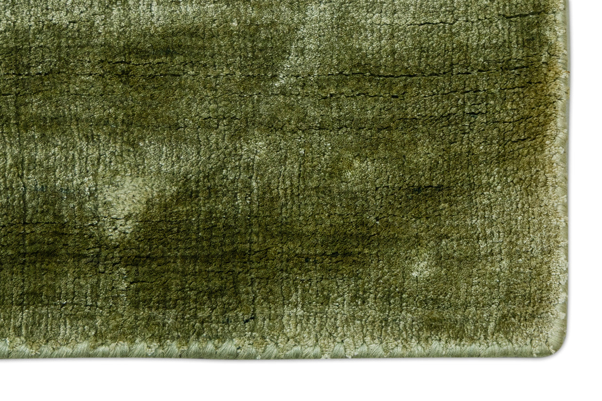 Detail Shot of Textured Green Hand-Loom Viscose Handmade Printed Rug for bed rooms, offices, and dining spaces