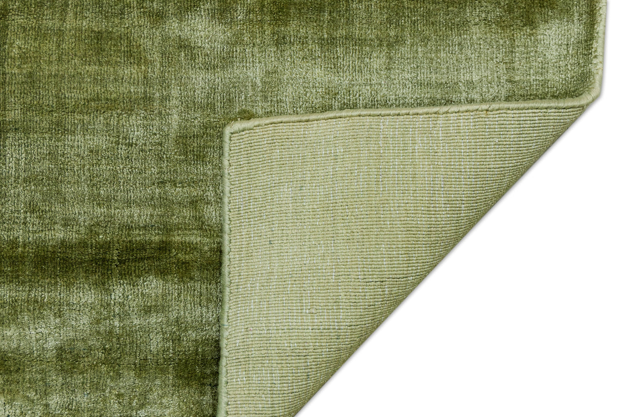 Detail Shot of Textured Green Hand-Loom Viscose Handmade Printed Rug for bed rooms, offices, and dining spaces