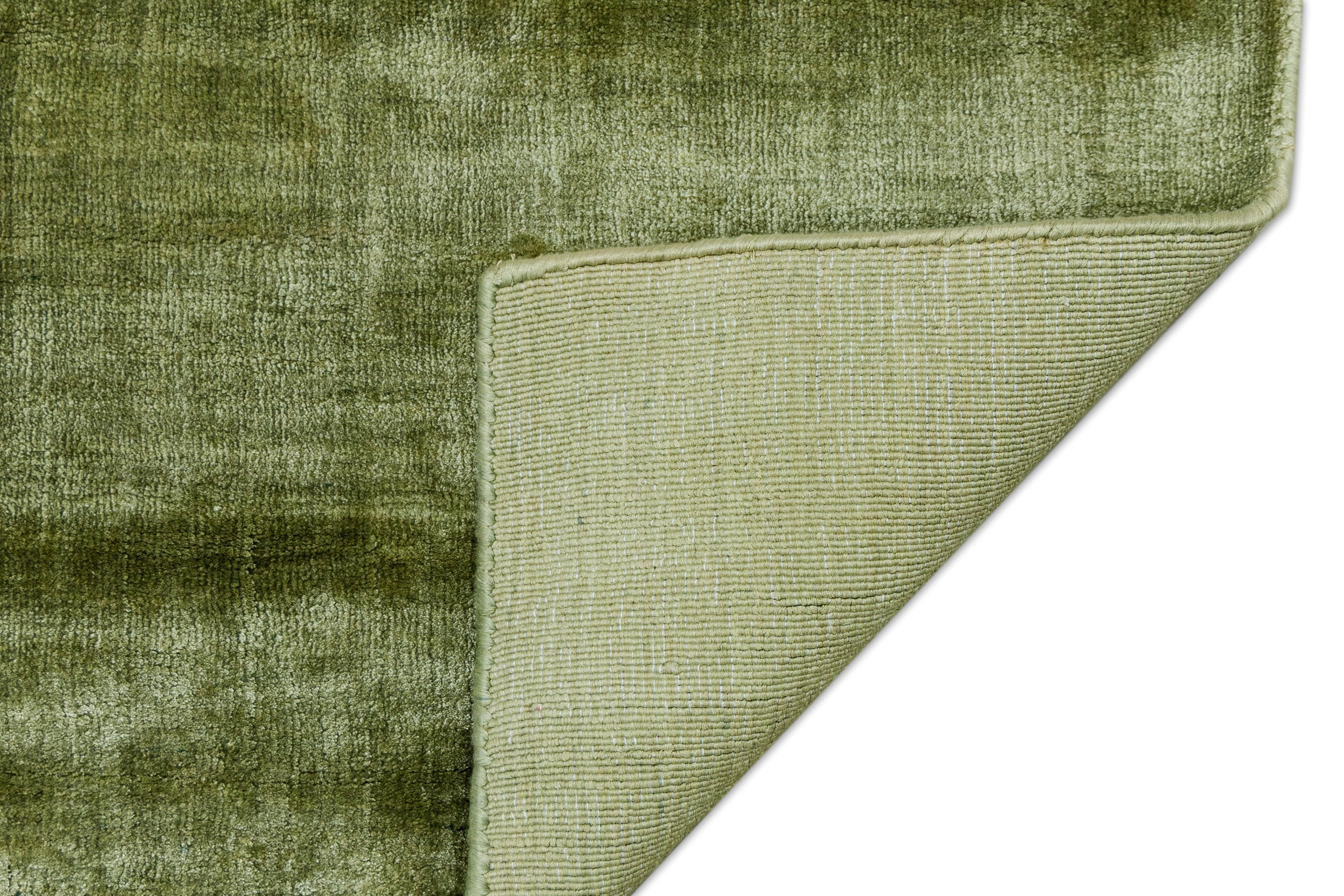 Detail Shot of Textured Green Hand-Loom Viscose Handmade Printed Rug for bed rooms, offices, and dining spaces