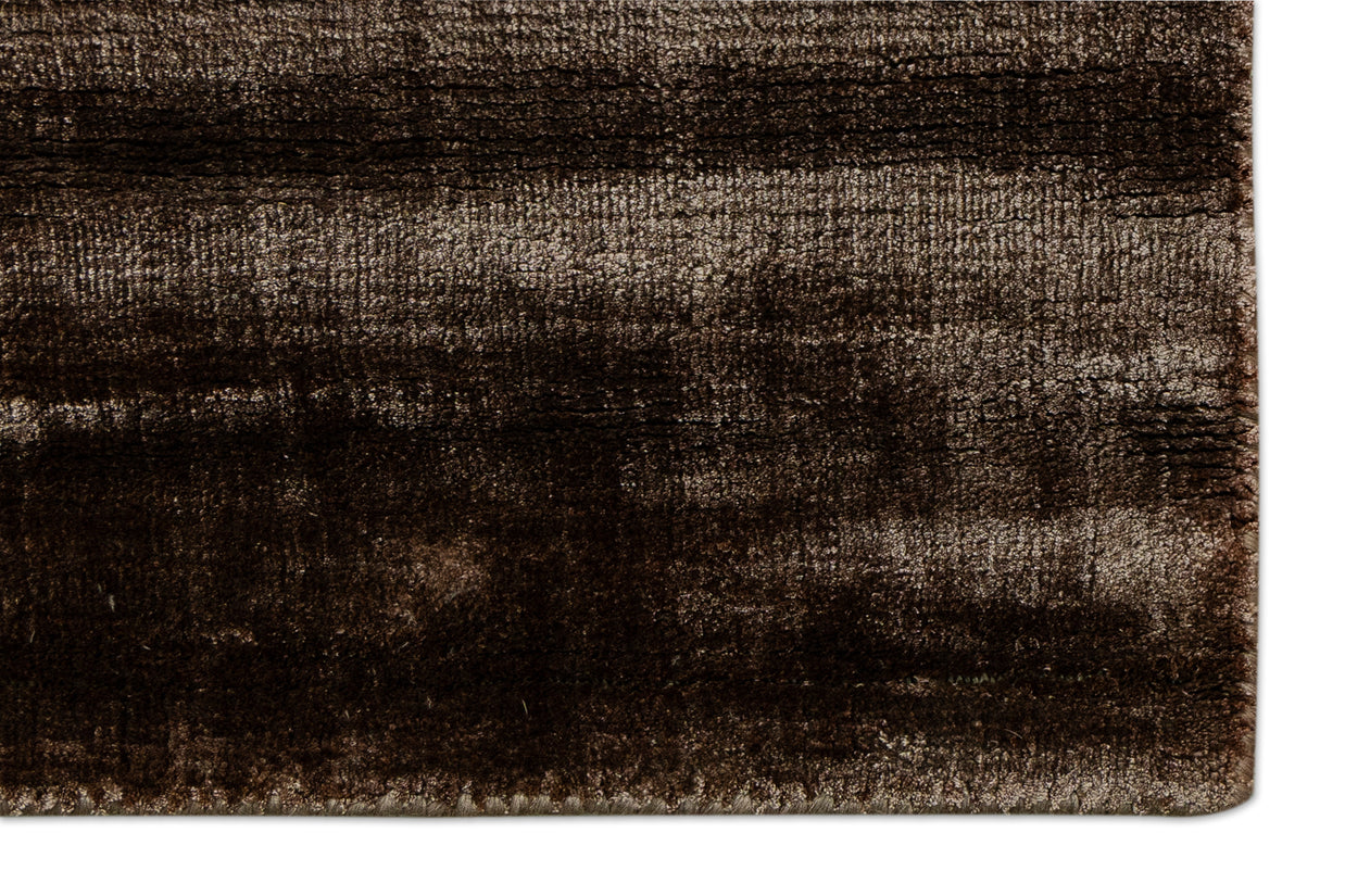 Detail Shot of a Textured Brown and Beige Hand-Loom Woolen Handmade Rug for bed rooms, offices, and dining spaces. 