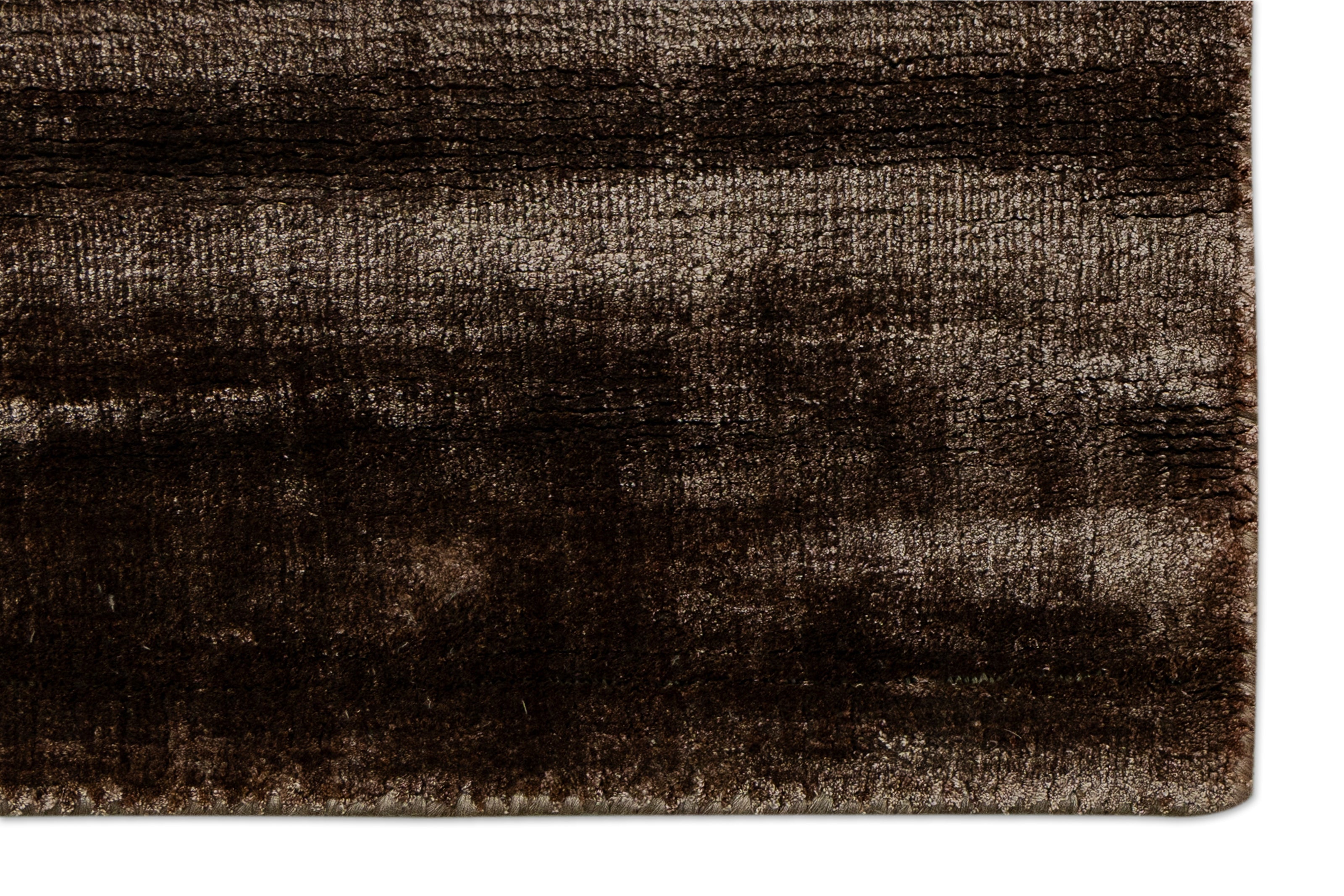 Detail Shot of a Textured Brown and Beige Hand-Loom Woolen Handmade Rug for bed rooms, offices, and dining spaces. 