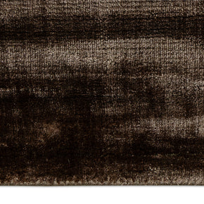 Detail Shot of a Textured Brown and Beige Hand-Loom Woolen Handmade Rug for bed rooms, offices, and dining spaces. 