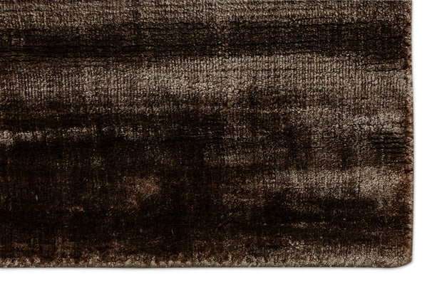 Detail Shot of a Textured Brown and Beige Hand-Loom Woolen Handmade Rug for bed rooms, offices, and dining spaces. 