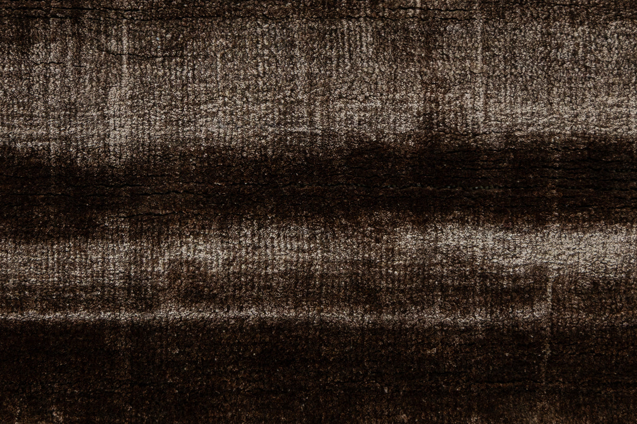 Detail Shot of a Textured Brown and Beige Hand-Loom Woolen Handmade Rug for bed rooms, offices, and dining spaces. 