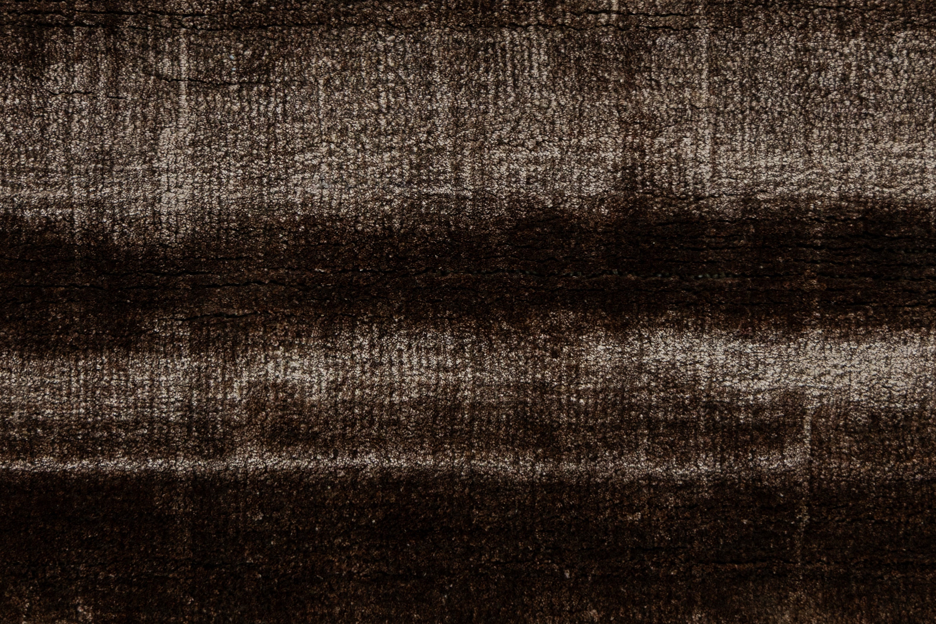 Detail Shot of a Textured Brown and Beige Hand-Loom Woolen Handmade Rug for bed rooms, offices, and dining spaces. 