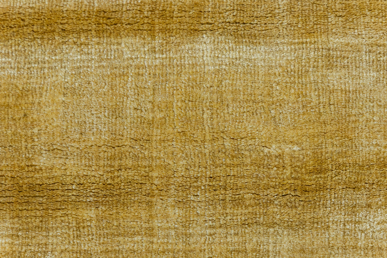 Detail Shot of Textured Gold and Beige Hand-Loom Viscose Handmade Rug for Modern bed rooms, offices, and dining spaces.