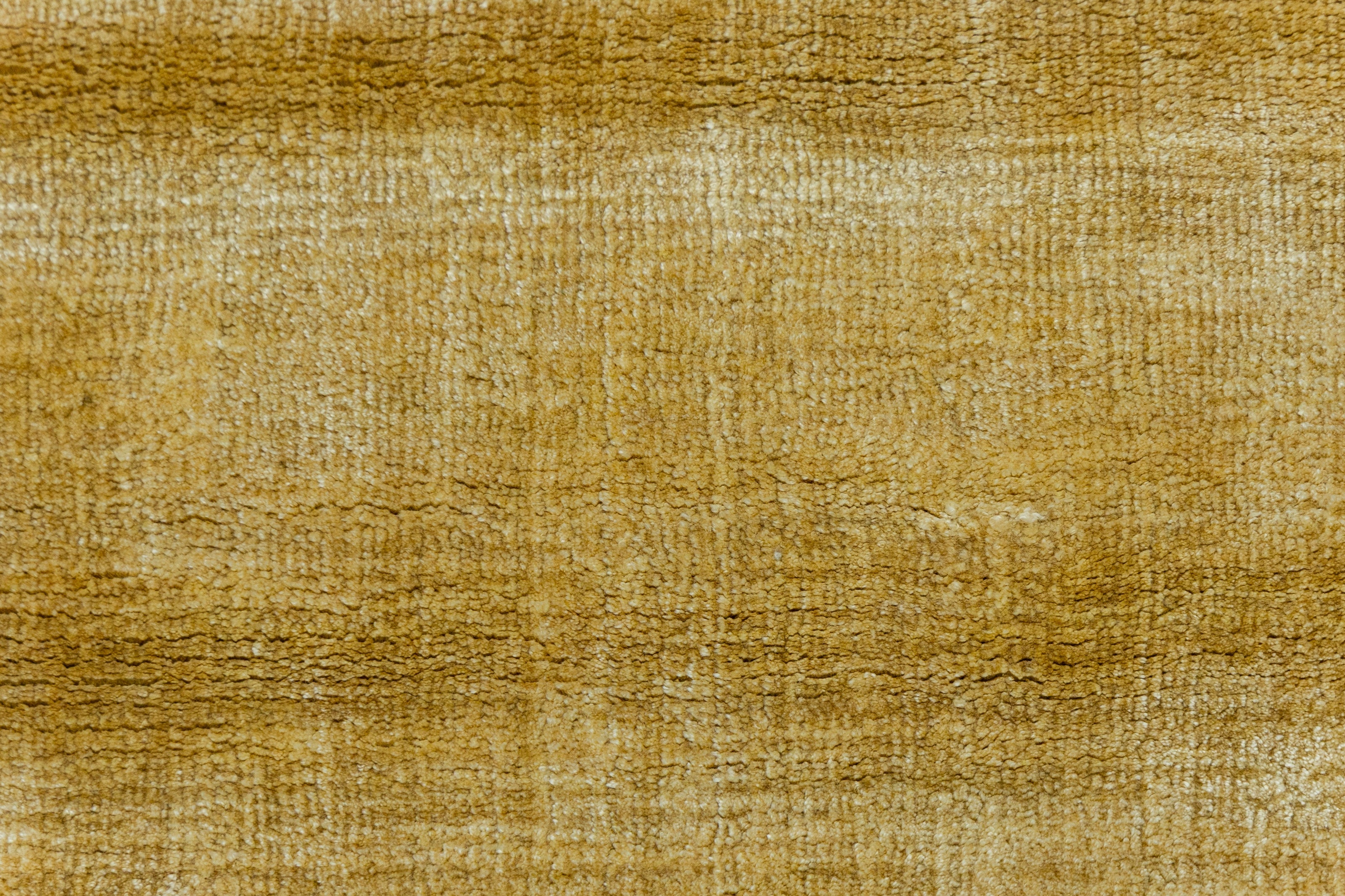 Detail Shot of Textured Gold and Beige Hand-Loom Viscose Handmade Rug for Modern bed rooms, offices, and dining spaces.
