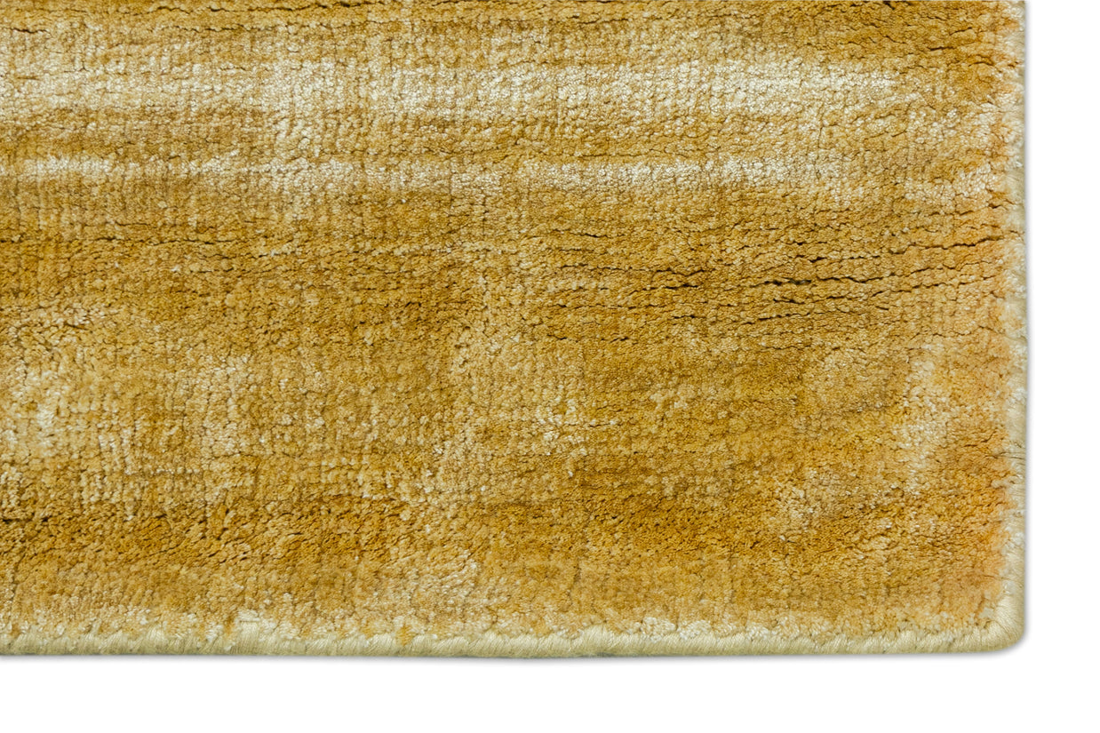 Detail Shot of Textured Gold and Beige Hand-Loom Viscose Handmade Rug for Modern bed rooms, offices, and dining spaces.