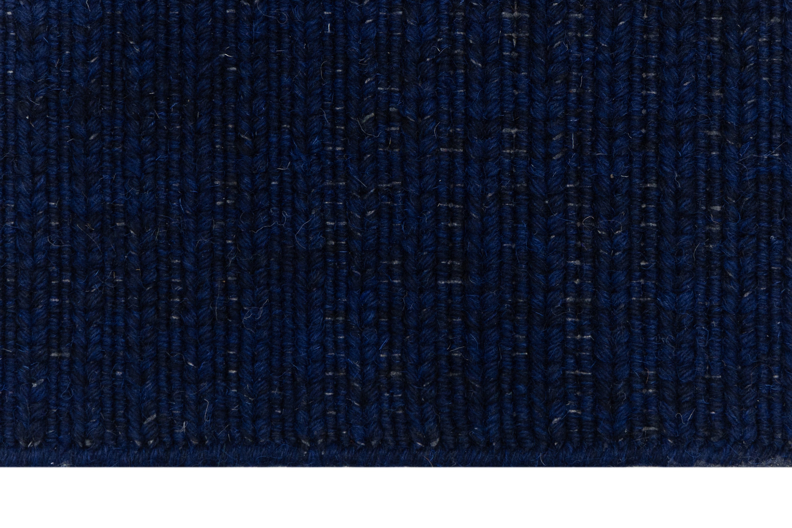 Clouse-up of Navy Blue Texture Hand-Woven Soumak woolen rug for bed rooms, offices, and dining spaces. 