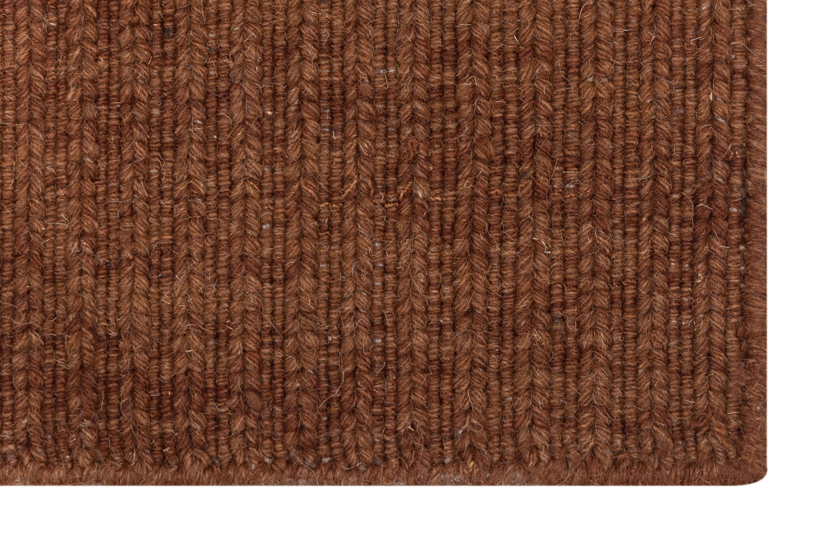 Close-up of Brown Texture Hand-Woven Soumak woolen rug for bed rooms, offices, and dining spaces. 