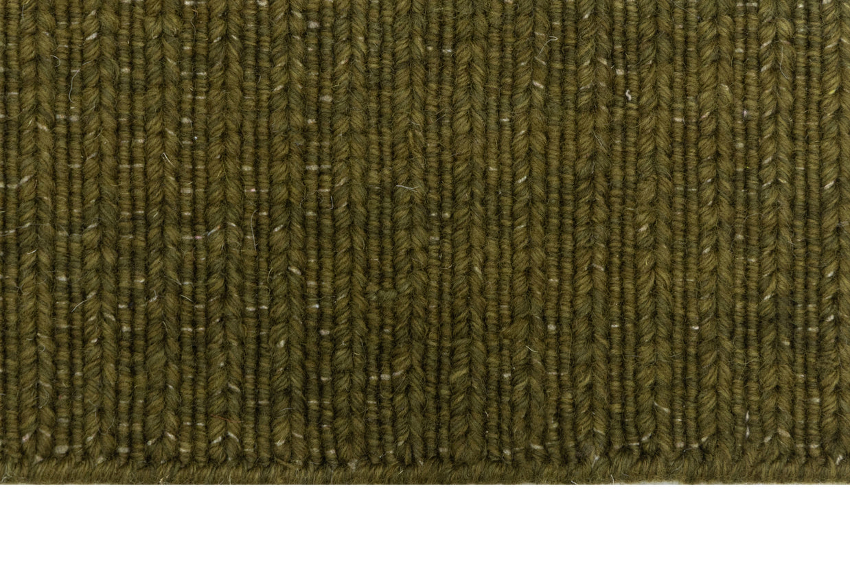 Close-up of Green Texture Hand-Woven Soumak woolen rug for bed rooms, offices, and dining spaces. 