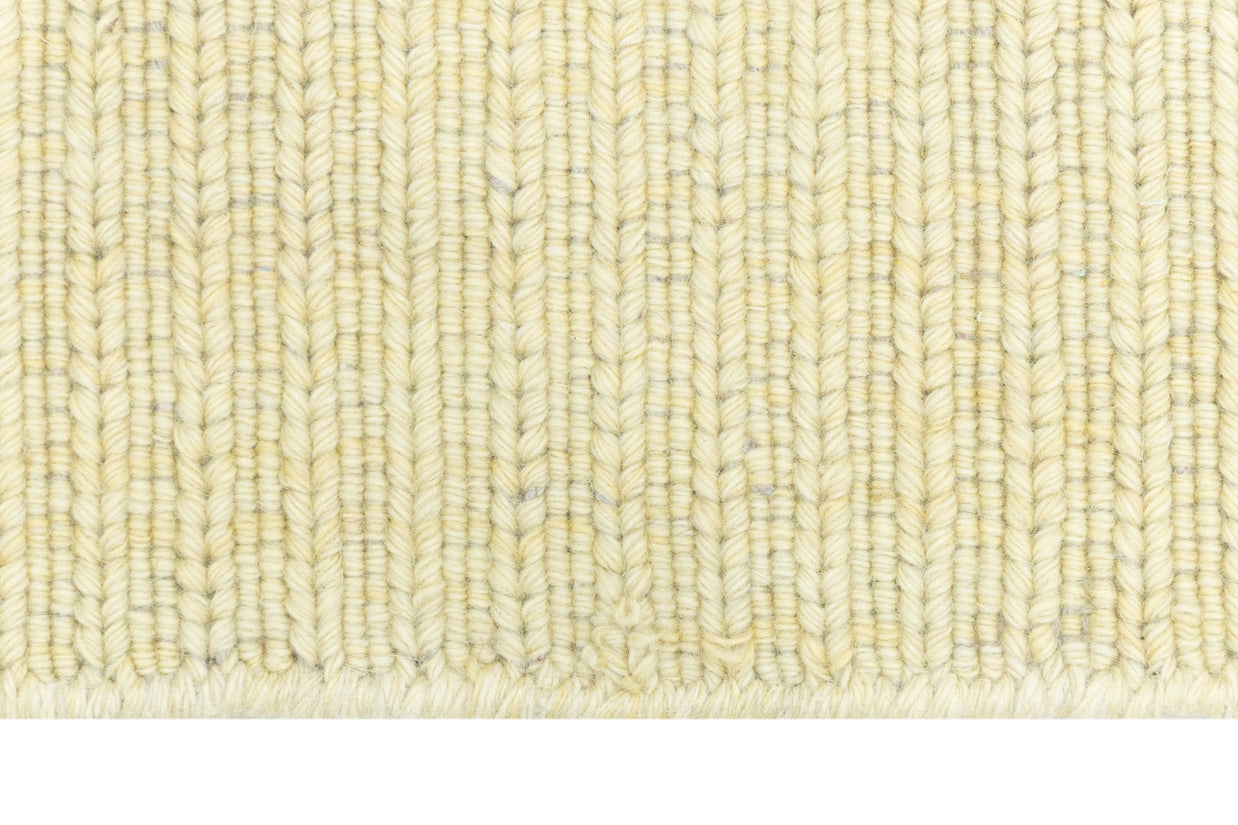 Close-up of Beige Texture Hand-Woven Soumak woolen rug for bed rooms, offices, and dining spaces. 