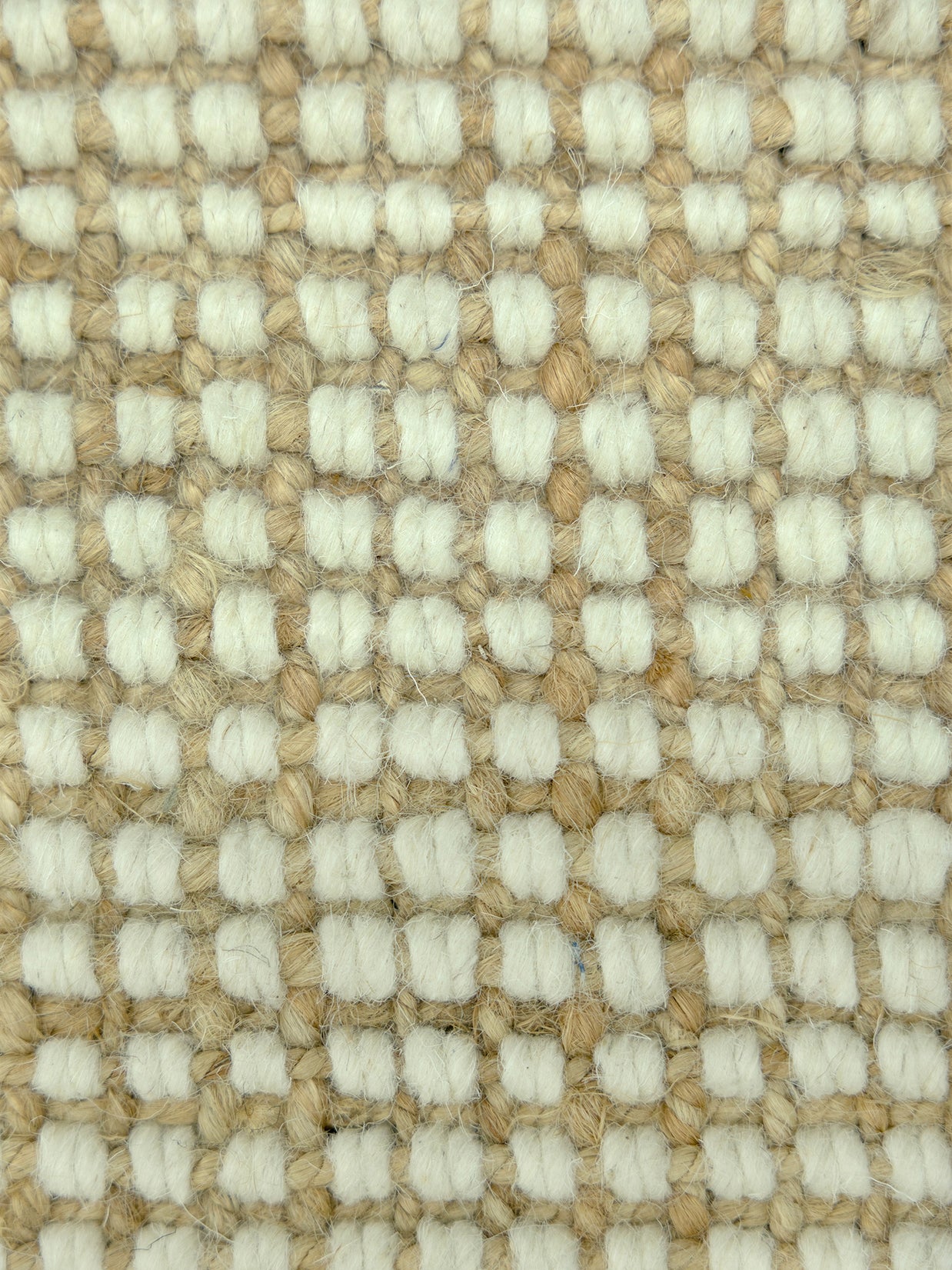 Alpine Grid | Handwoven Pitloom Rug, Close-up of a textured jute and wool beige and cream carpet pattern
