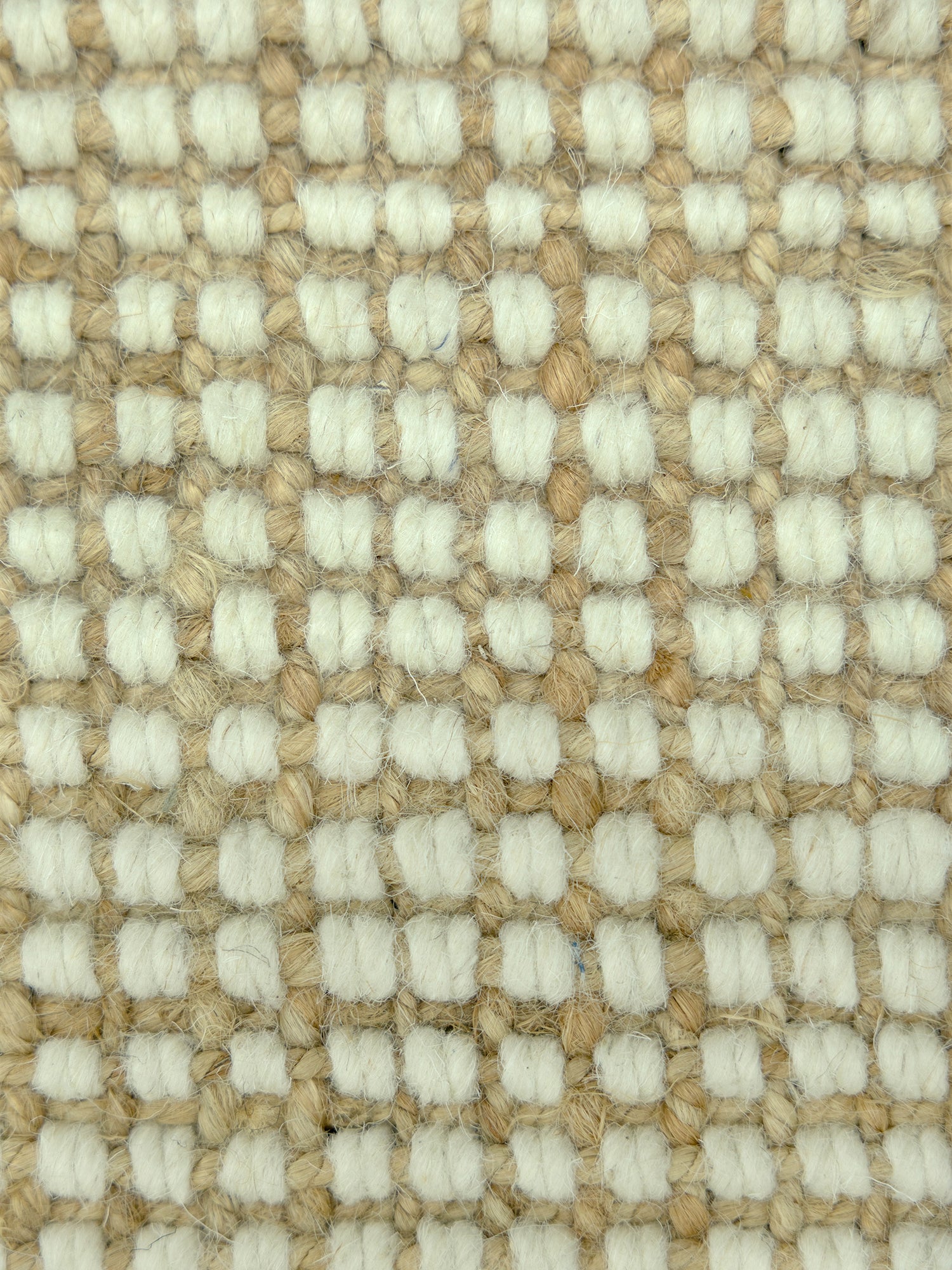 Alpine Grid | Handwoven Pitloom Rug, Close-up of a textured jute and wool beige and cream carpet pattern