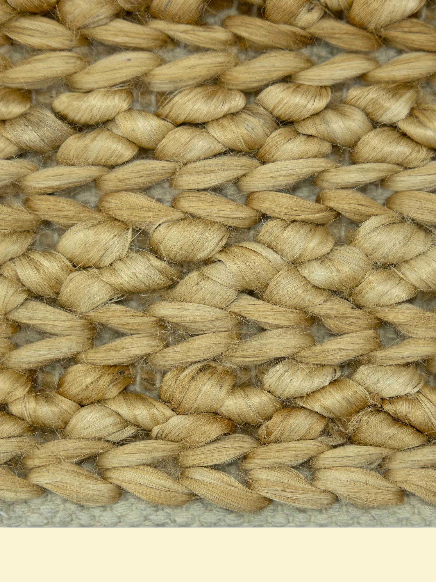 Desert Basket | Handwoven Pitloom Jute Rug, Close-up of woven natural jute material