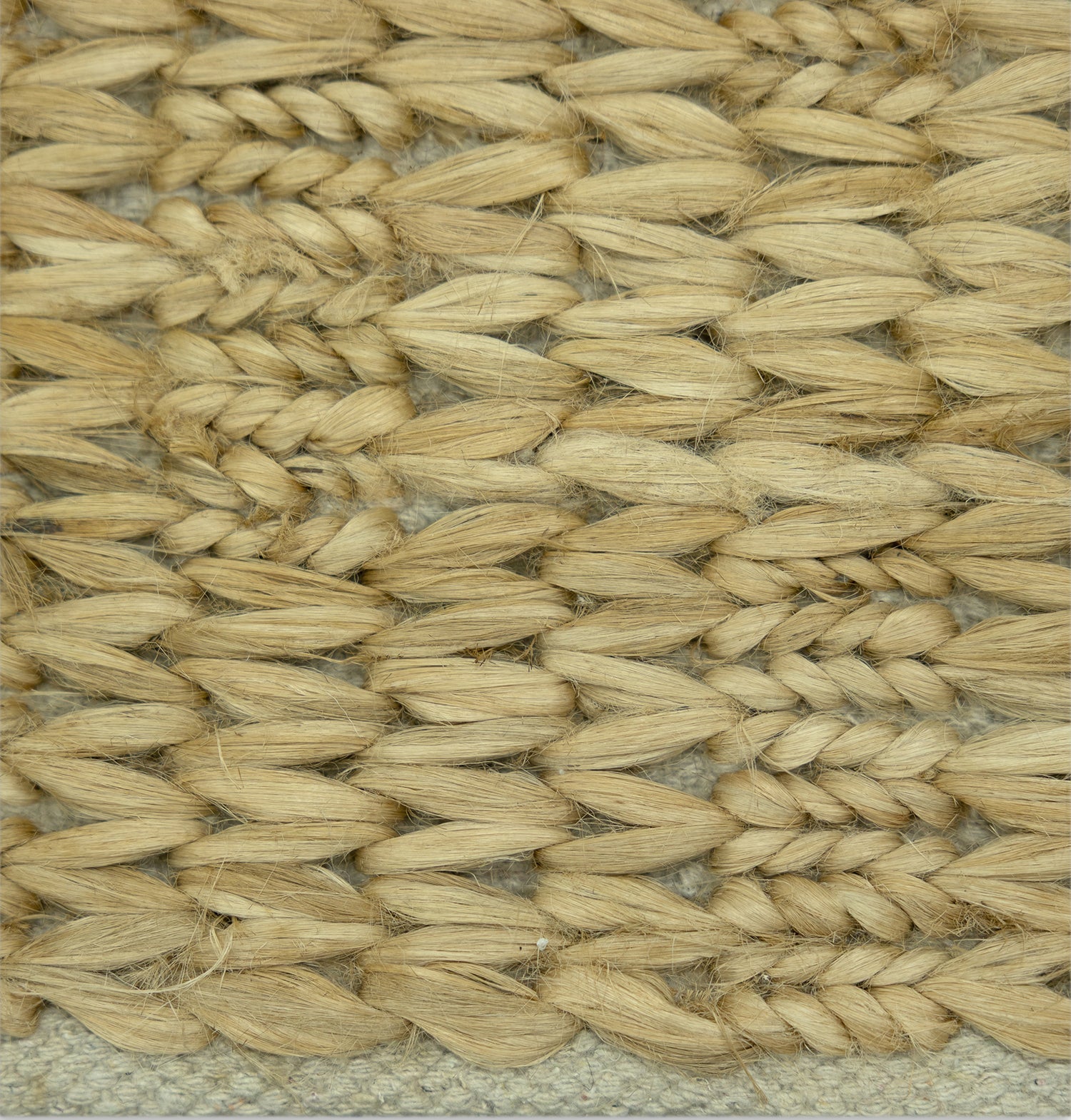 Desert Chevron | Handwoven Pitloom Jute Rug, Close-up of a woven natural fiber jute rug with a textured pattern.