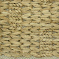 Desert Chevron | Handwoven Pitloom Jute Rug, Close-up of a woven natural fiber jute rug with a textured pattern.