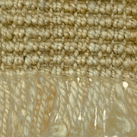 Desert Loom | Handwoven Pitloom Durrie, Close-up of a textured jute rug with fringes