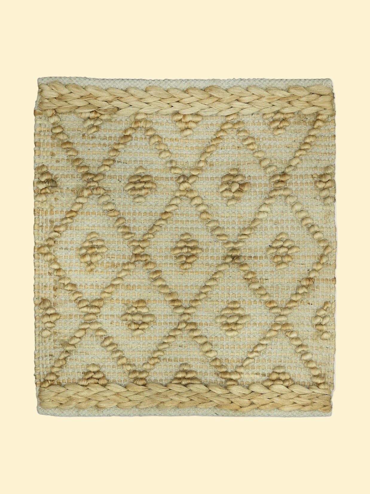 Desert Mosaic | Handwoven Pitloom Jute Rug, Textured woven mat with geometric pattern on a white background