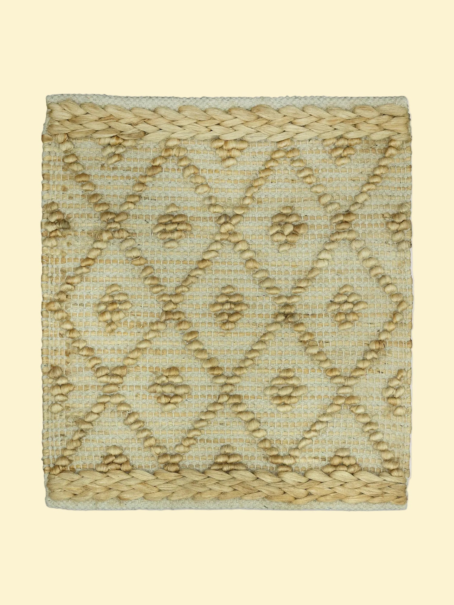 Desert Mosaic | Handwoven Pitloom Jute Rug, Textured woven mat with geometric pattern on a white background