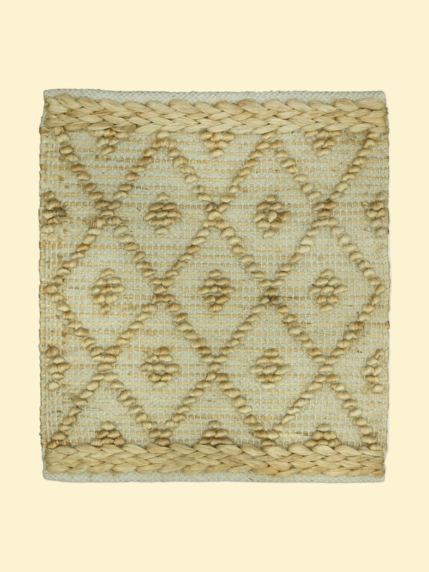 Desert Mosaic | Handwoven Pitloom Jute Rug, Textured woven mat with geometric pattern on a white background