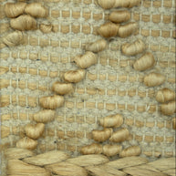 Desert_Mosaic_Handwoven_Pitloom_Jute_Rug_Detail, Close-up of a woven natural jute and wool mat with a geometric pattern.