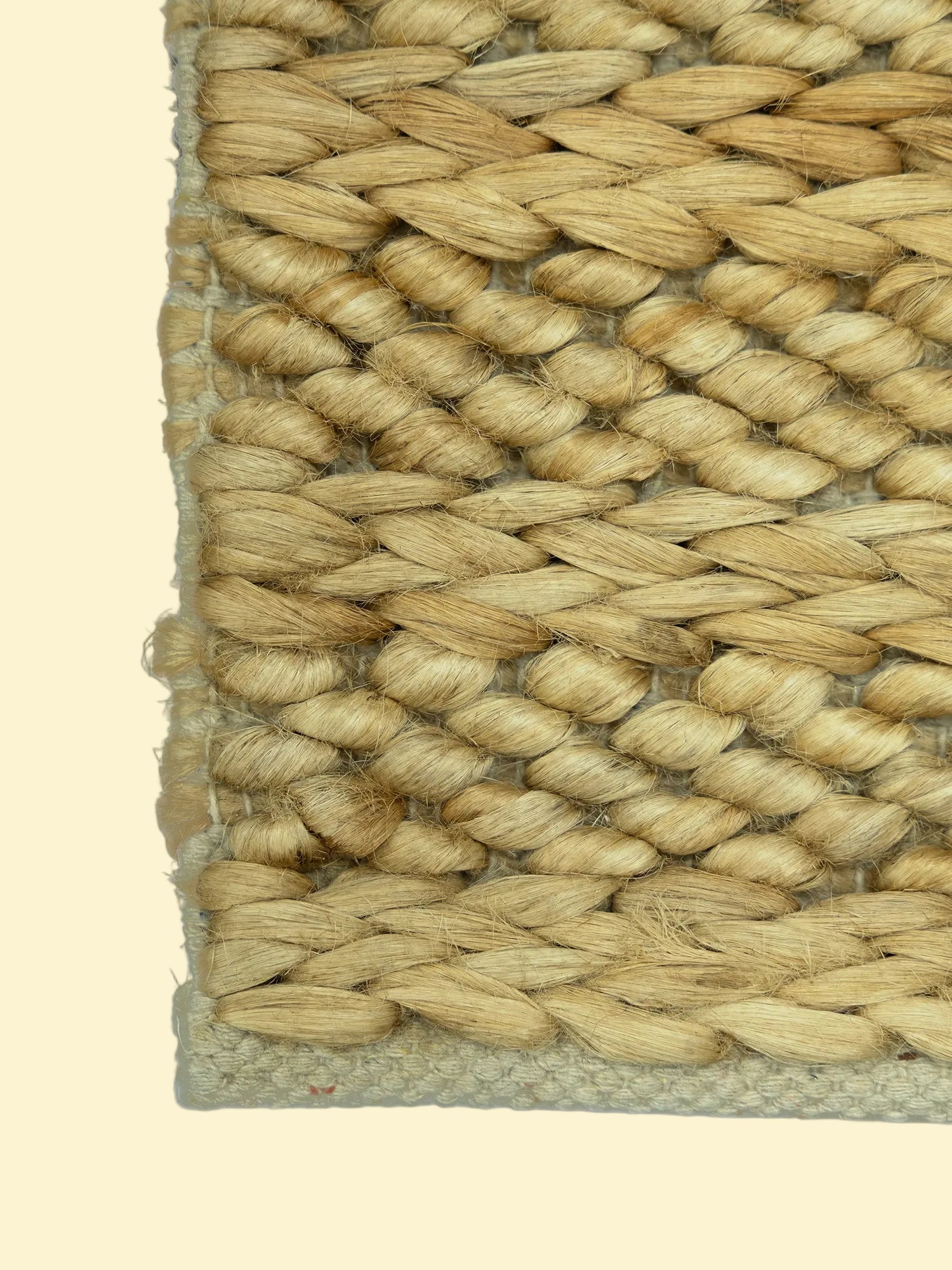 Golden Dune | Handwoven Pitloom Jute Rug, Close-up of a woven natural fiber rug corner